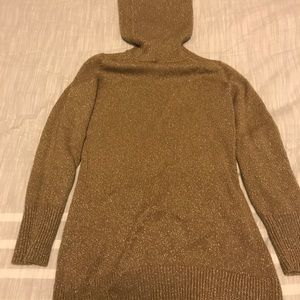 Gold metallic turtleneck sweater.